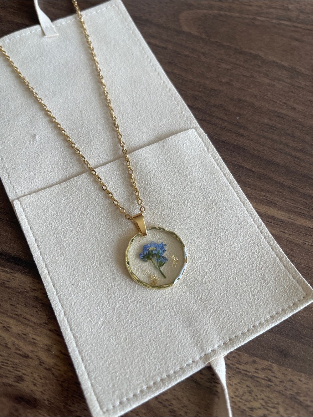 Gold-Tone Necklace with Blue Floral Resin Pendant